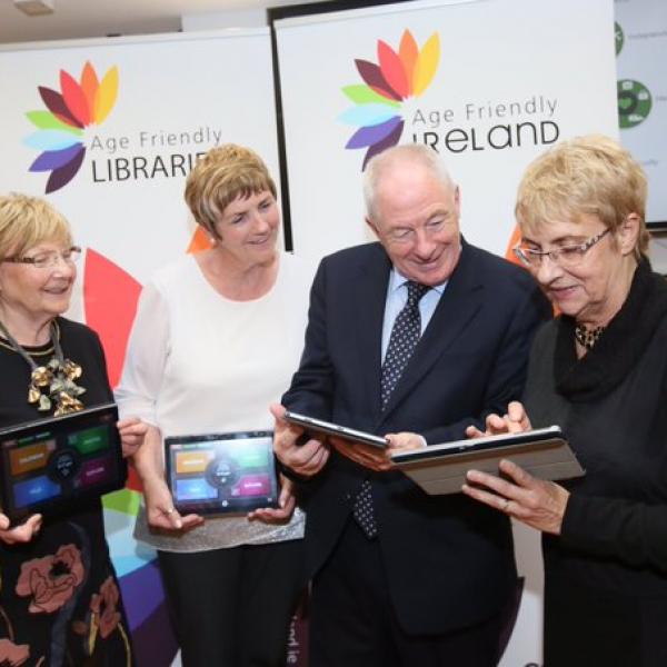 Members of Meath and Fingal’s Older People’s Councils showing Minister Ring the benefits of using their ACORN tablet