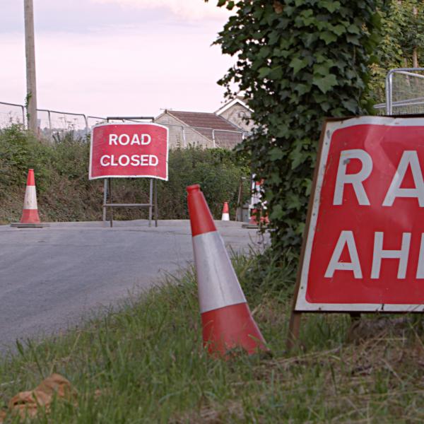 Road closed and road works ahead sign