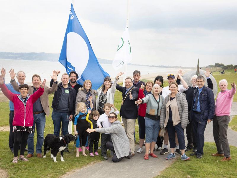 The Lord Moyor of Fingal Cllr Anthony Lavin is joined by Councillors and The Red Hot Mommas Swimming Group to celebrate Portmarnack Beach receiving a Blue Flag.