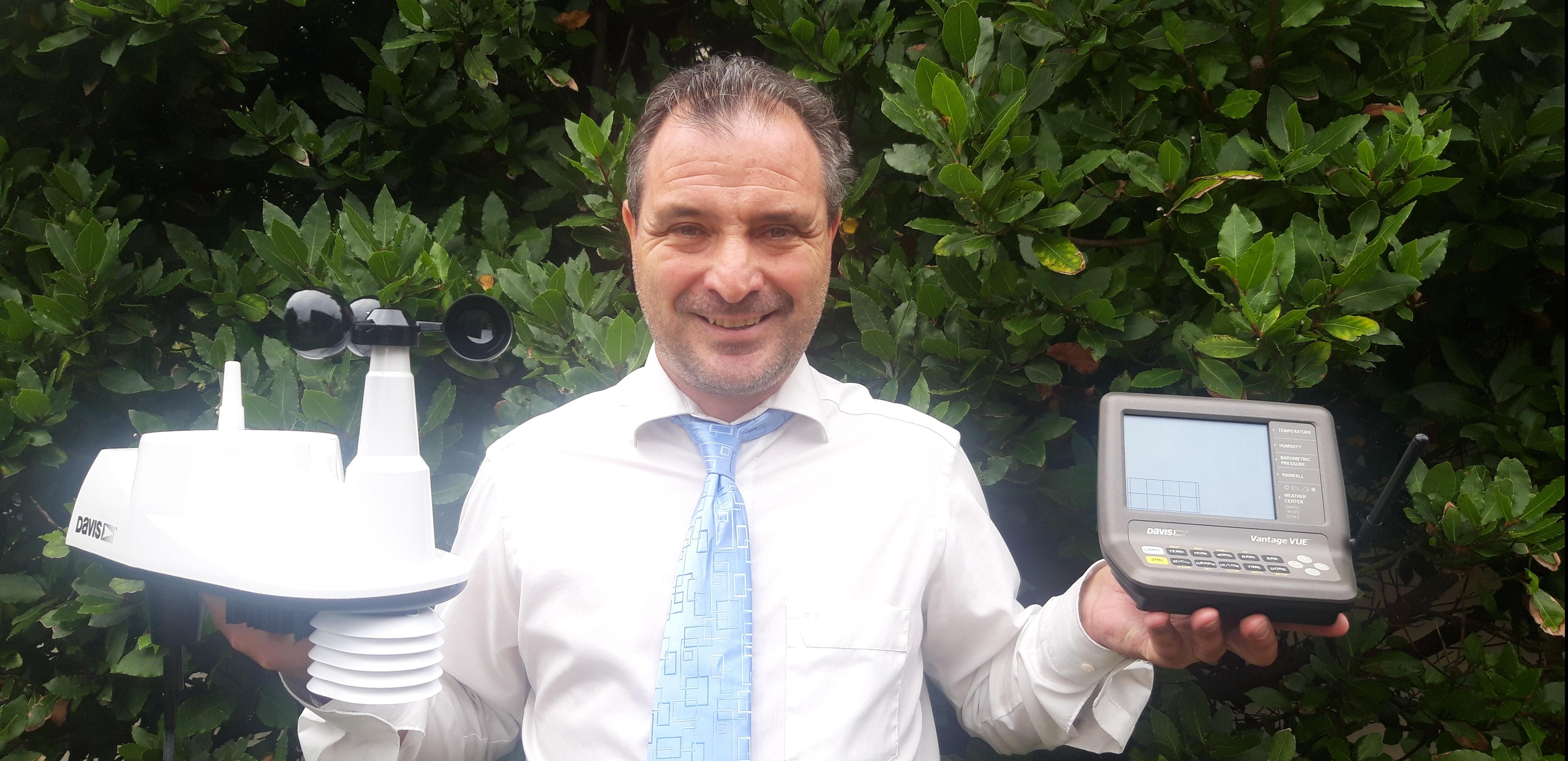 Kevin Vallely holding weather station