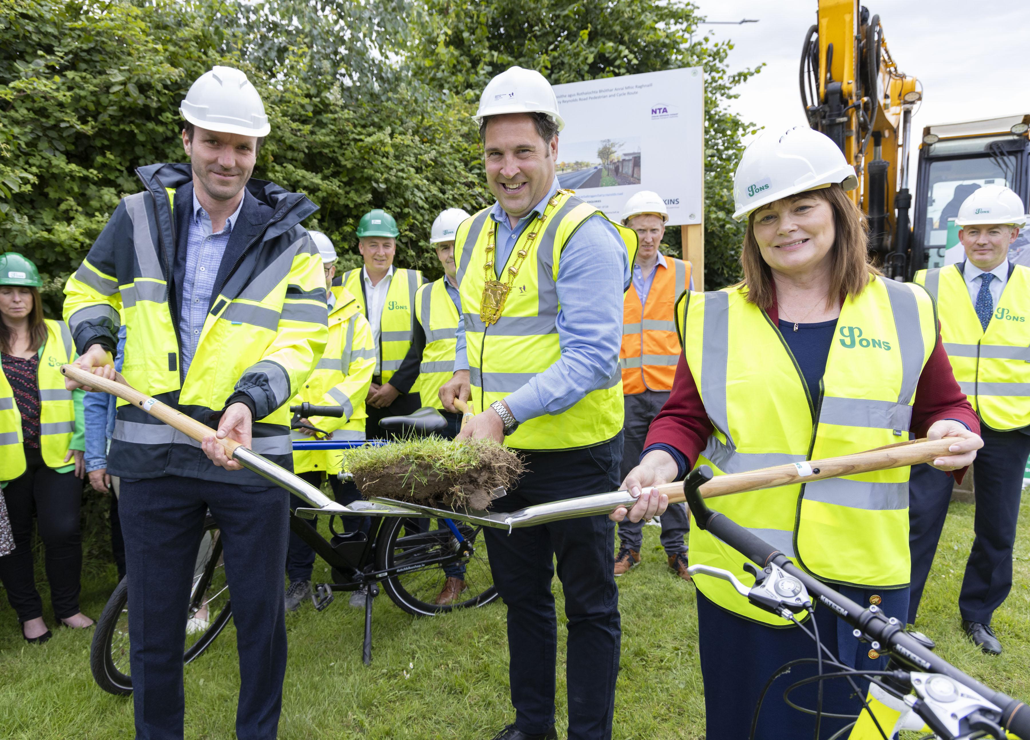 mayor turns sod on spade 