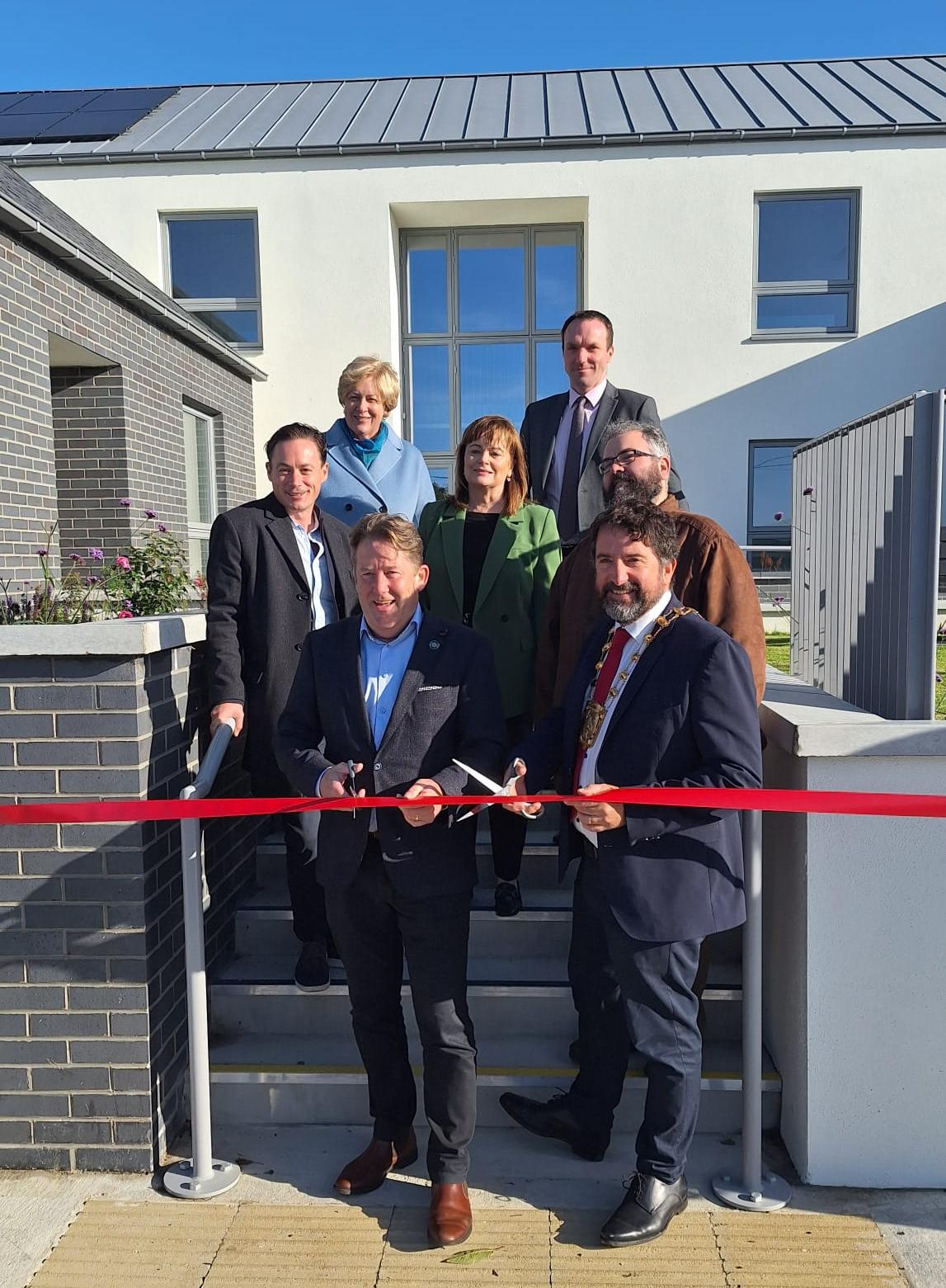 Ribbon cutting Monastery Court