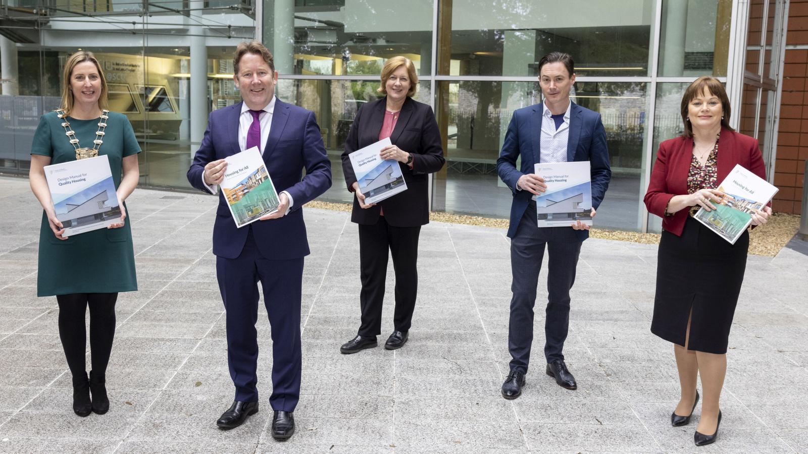 Minister for Housing, Local Government and Heritage, Darragh O'Brien TD presents a copy of the Design Manual for Quality Housing, and a Review of Pre-Construction Processes for Social Housing Construction and Mixed Tenure Projects to Mayor of Fingal Cllr Seána Ó Rodaigh, Fingal County Architect Fionnuala May, Cllr Robert. O'Donoghue, Chair of the Housing Strategic Policy Committee and Fingal County Council Chief Executive AnnMarie Farrelly. 